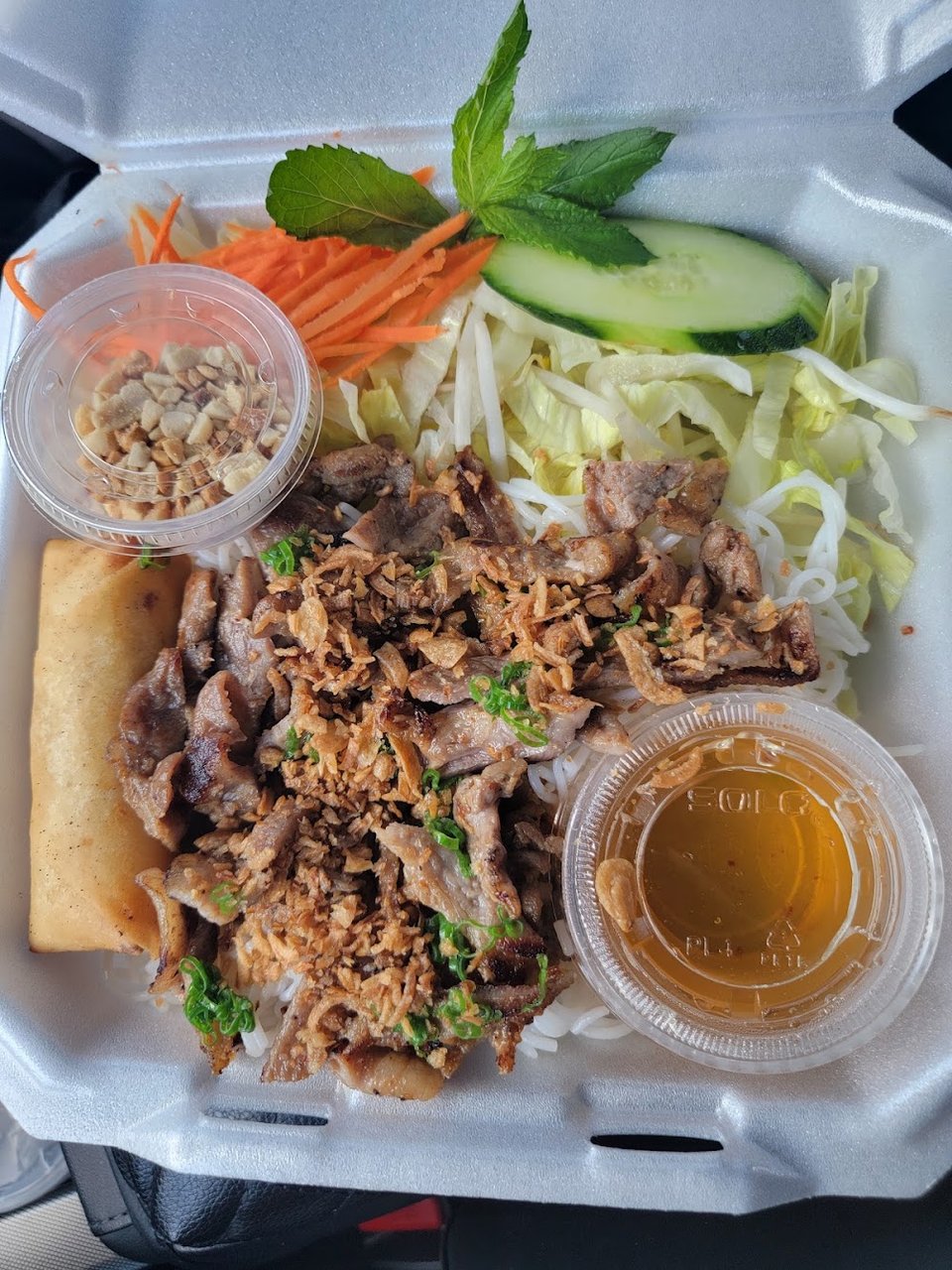 Printed menu for pho, small plates, and comfort food.